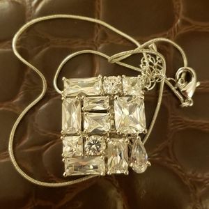 Very unique silver and diamond pendant necklace